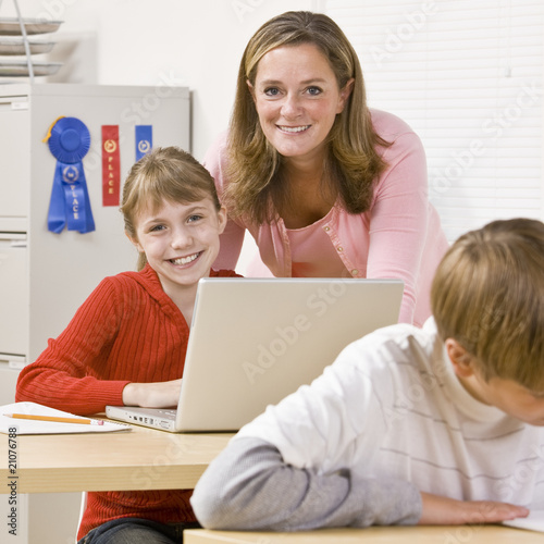 Teacher helping student