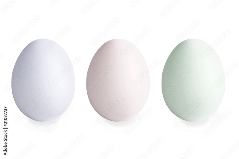 Three multi-coloured eggs on a white