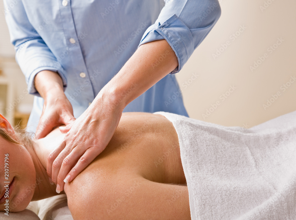 Fototapeta premium Massage therapist giving woman massage