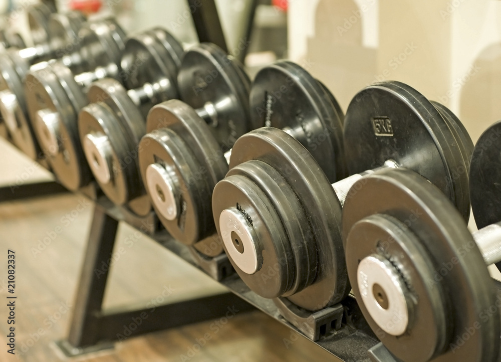 Dumbbell weights on a rack