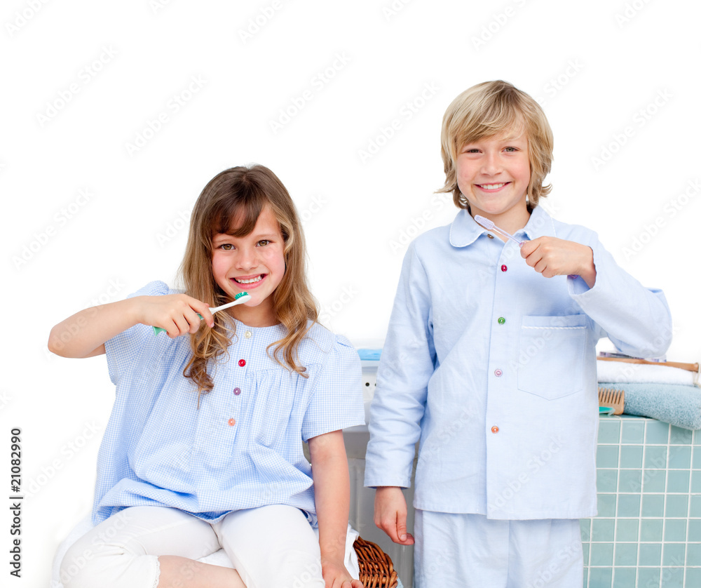 Smiling brother and siter brushing their teeth Smiling brother and siter brushing their teeth