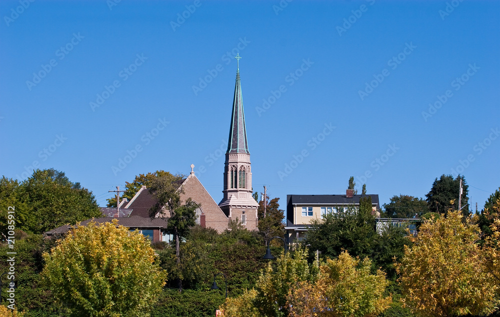 Steeple Over Trees in Small Town