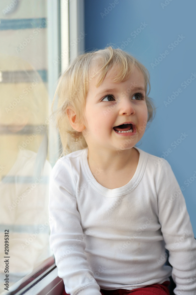 girl sits at window girl sits at window