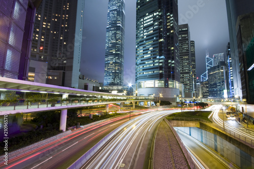 Hong Kong at night with highrise buildings.