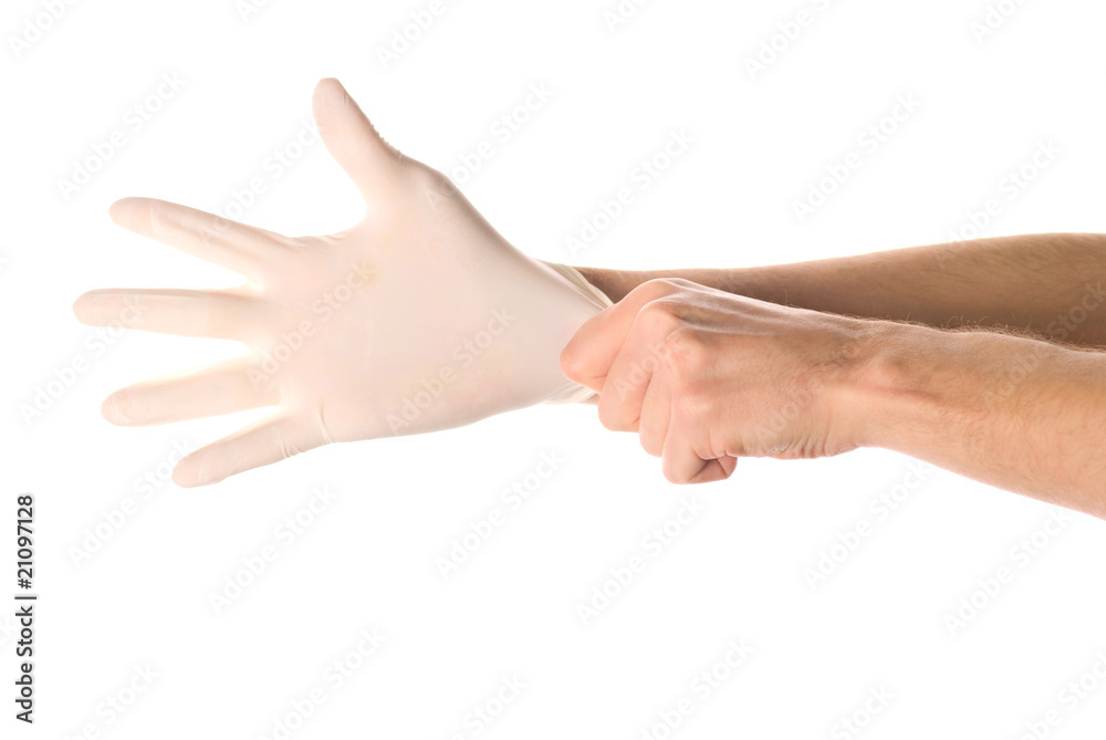 Hands of person putting on a medical glove isolated on white