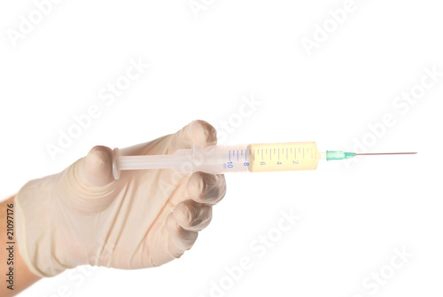 hand holding syringe before making injection