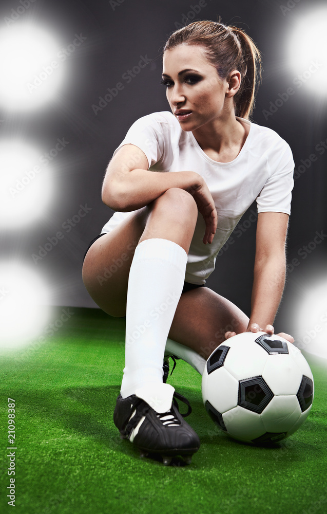 Sexy soccer player, woman on playing field