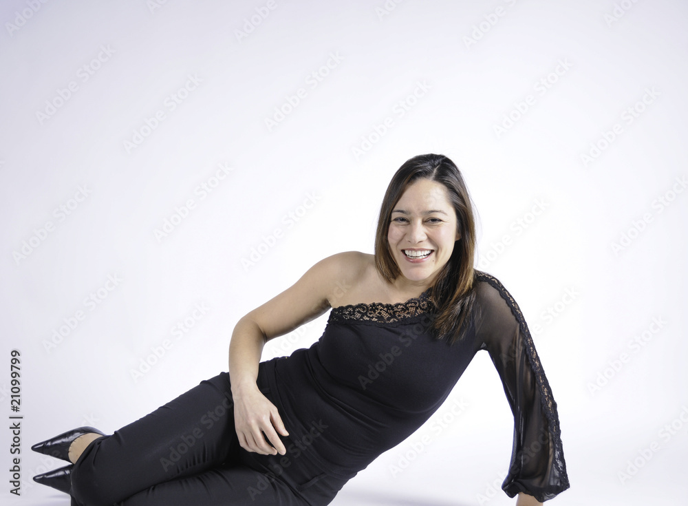 Young lady sitting sideways with big smile Young lady sitting sideways with big smile