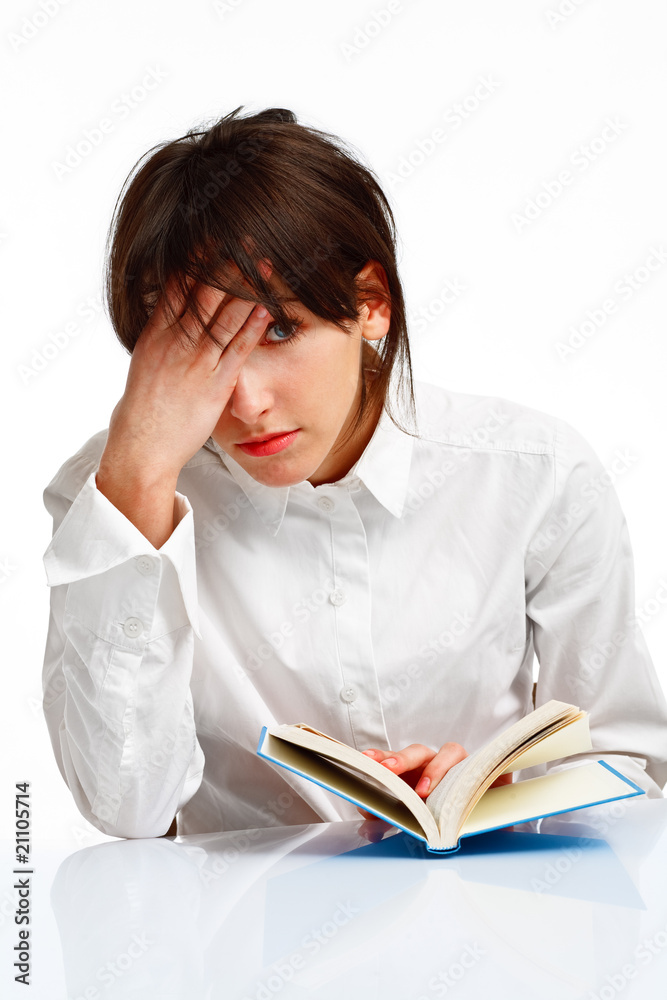 young woman tired of reading a book young woman tired of reading a book