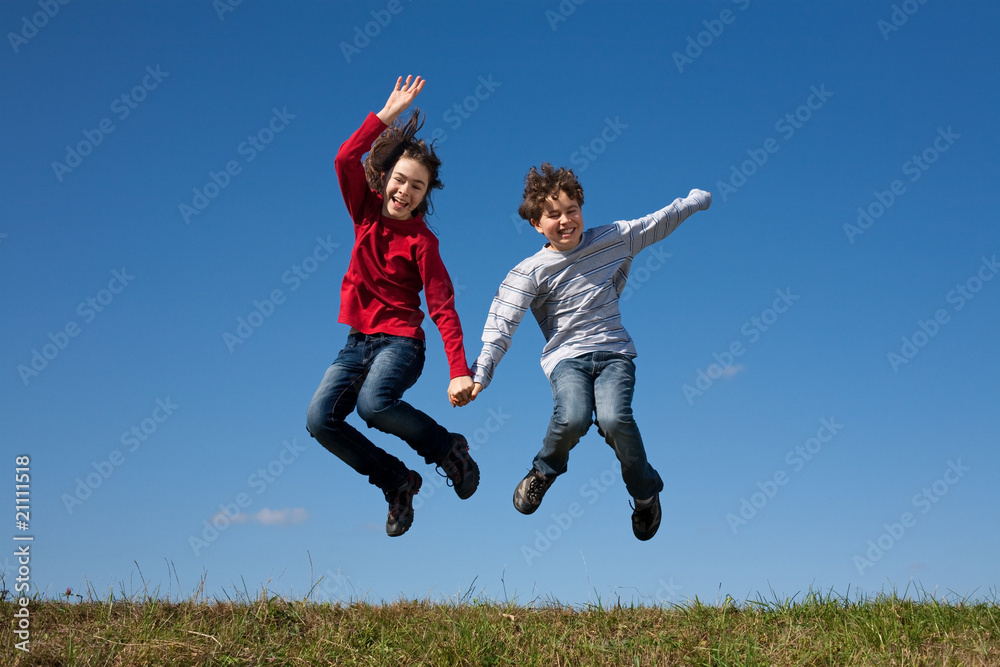 Girl and boy jumping, running outdoor Girl and boy jumping, running outdoor