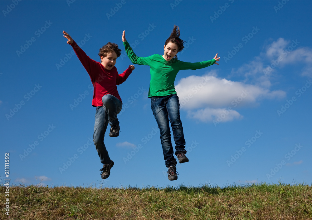 Girl and boy jumping, running outdoor Girl and boy jumping, running outdoor