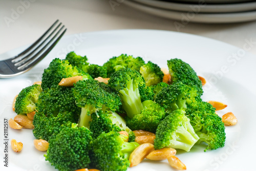Bild auf Leinwand fresh sauteed broccoli and almonds