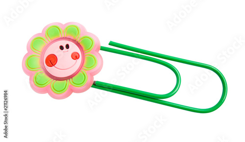 Fotografija Green paper clip with a smiling flower isolated over white