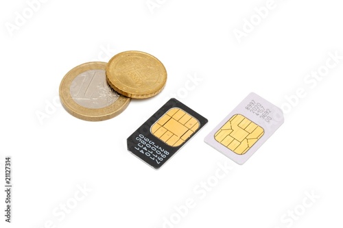 Two SIM cards for cellular phones and euro cents isolated photo