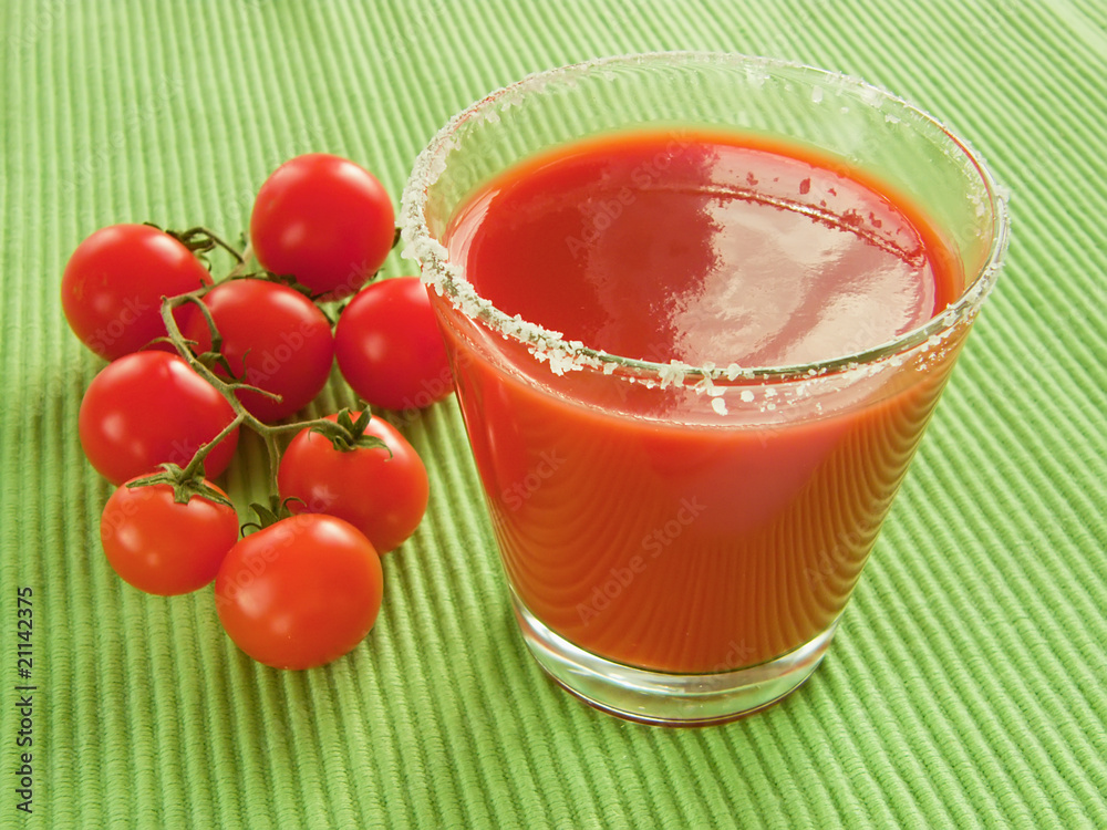 Tomato juice and sprig of cherry tomatoes, close-up Tomato juice and sprig of cherry tomatoes, close-up