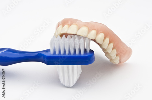 Dentures with brush