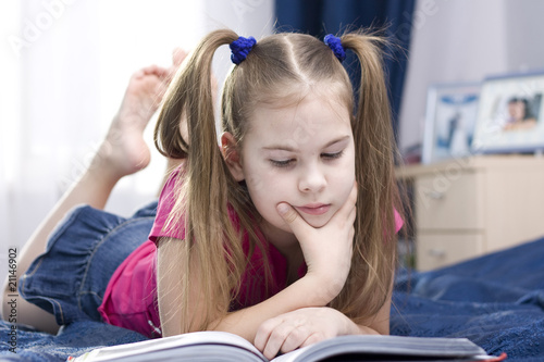 Girl reading a book.