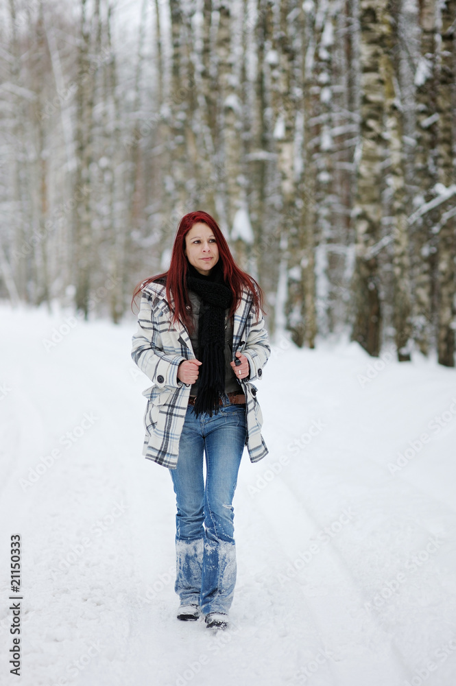 Young woman in snowy forest Young woman in snowy forest