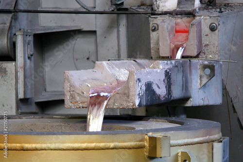 liquid aluminium, coming out an oven in a factory