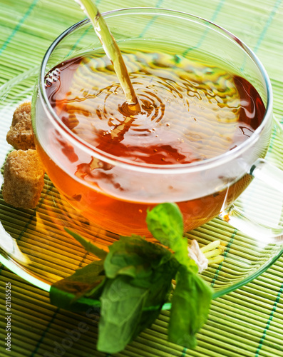 Pouring Herbal Tea photo