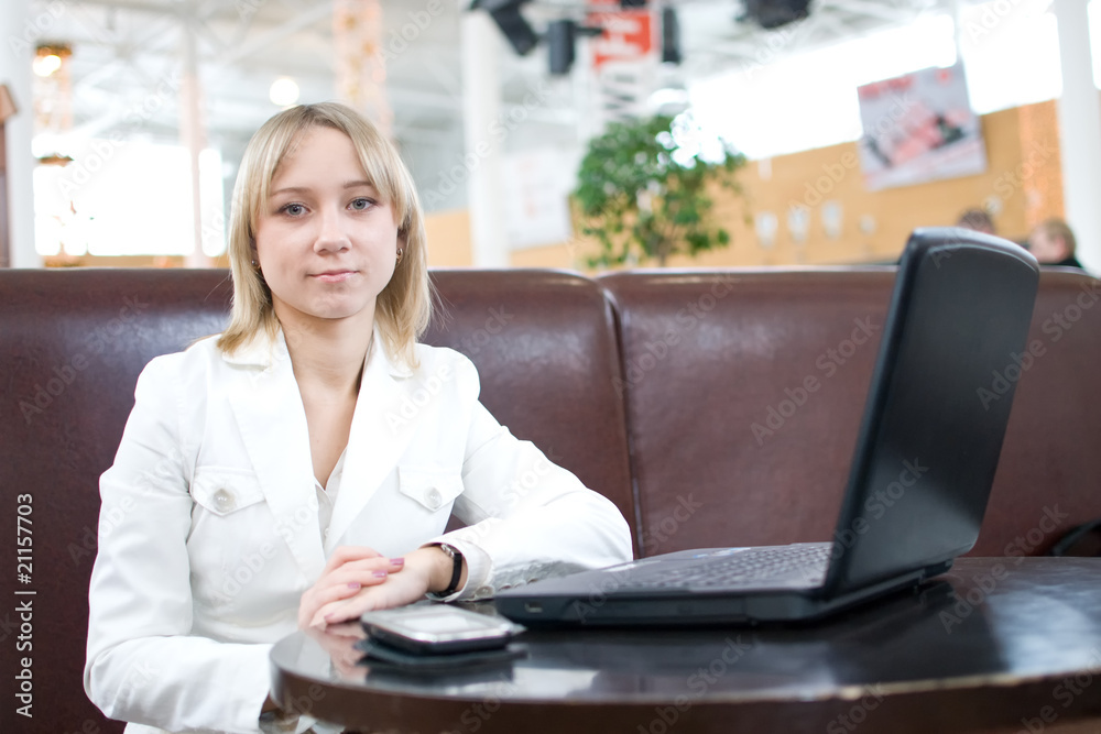 Young businesswoman with notebook in cafe Young businesswoman with notebook in cafe