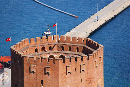 Port Alanya and red brick tower photo