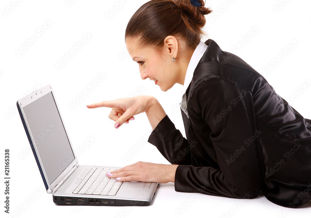 young woman is lying on the floor and working on a laptop.. young woman is lying on the floor and working on a laptop..