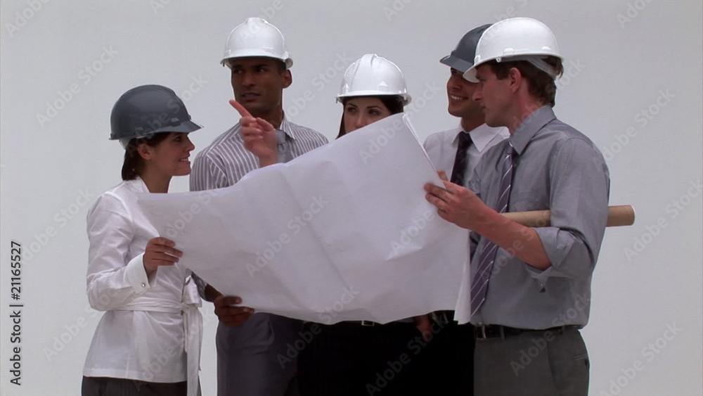 Ambitious architects studying blueprint Ambitious architects studying blueprint