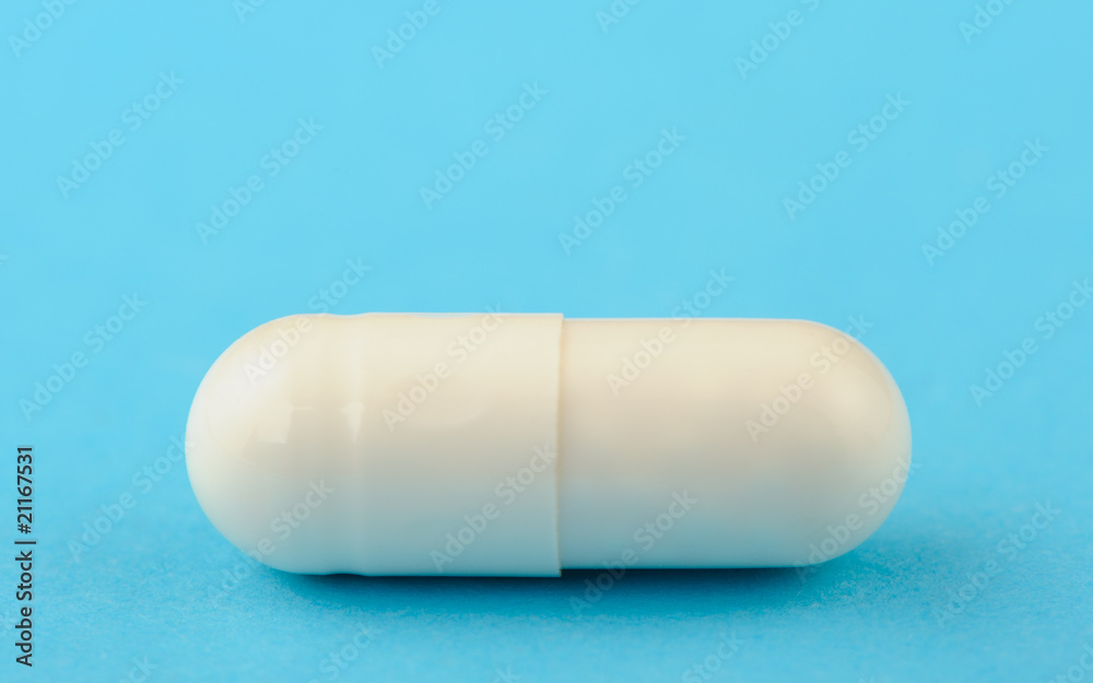 Obraz premium White tablet on a blue background.