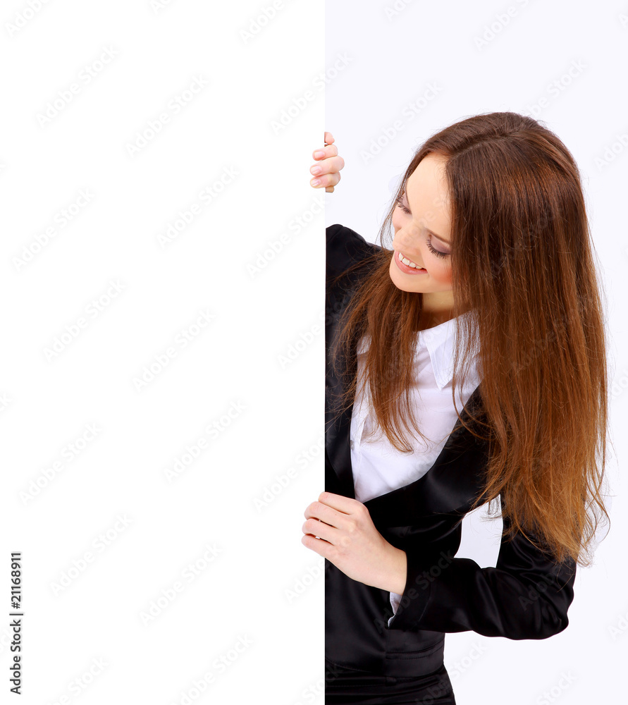 Isolate of a business woman standing beside a blank board. Isolate of a business woman standing beside a blank board.