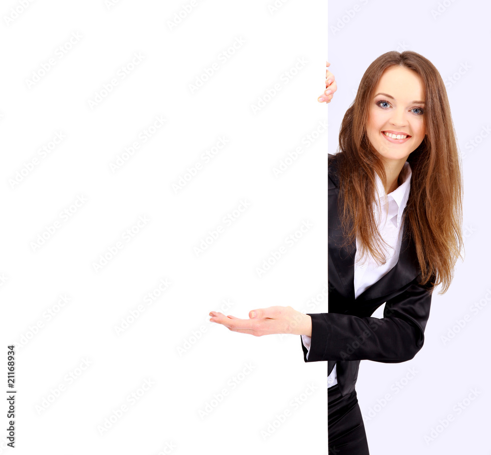 Businesswoman standing and holding a white empty billboard Businesswoman standing and holding a white empty billboard