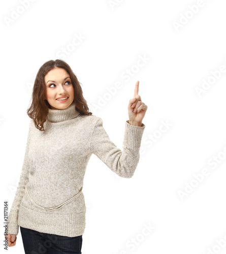 Smiling young woman pointing towards open space © ASDF