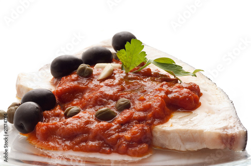 messinese swordfish typical sicily recipe with olive and caper photo