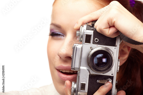 Beautiful young woman with camera...