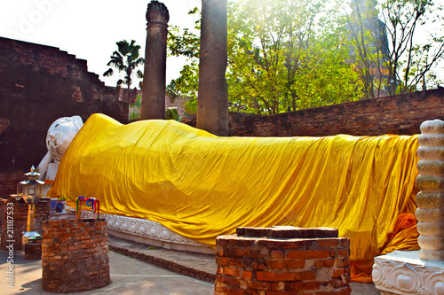 lying Buddha dressed in yellow scarf in temple Wat Chai Mongkol photo