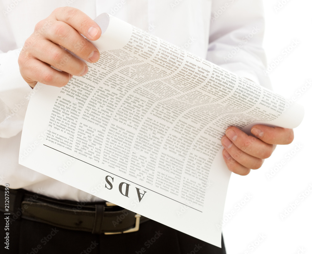 Naklejka premium Man reading ads from the paper