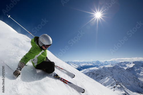 Skier with sun and mountains © blende64