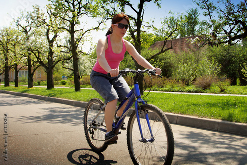 young lady driving bicycle