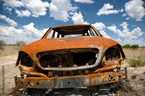 Recently burned cars in the desert of Kalahari photo