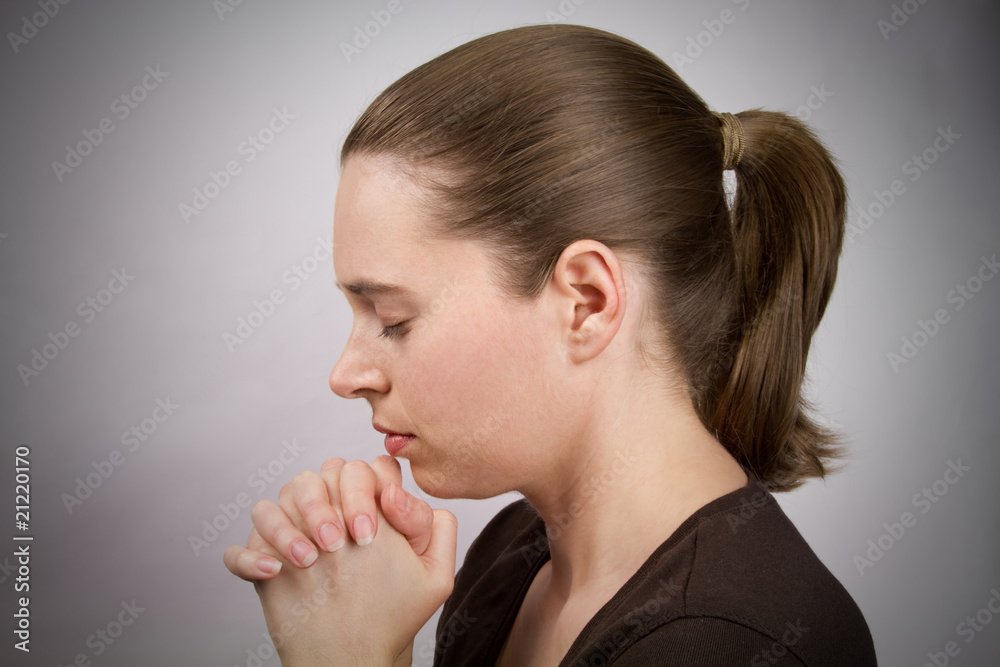 Young woman praying Young woman praying