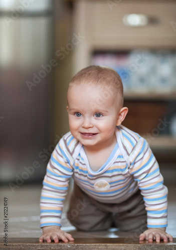 cute little baby boy in front of the library