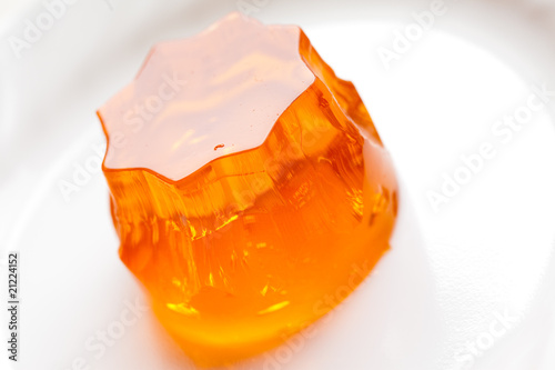 orange jello on white plate, close-up photo