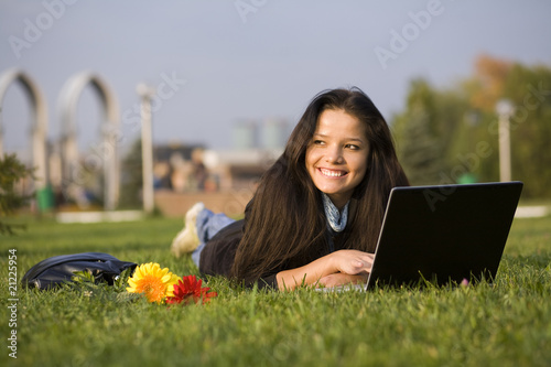 Woman with notebook at the summer park