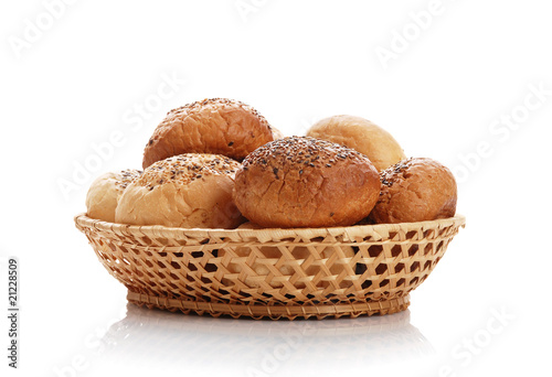 Buns with sesame in a woven basket