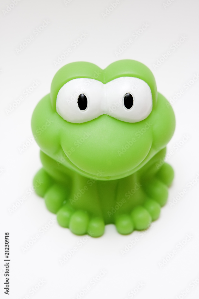 toy rubber green frog on white background