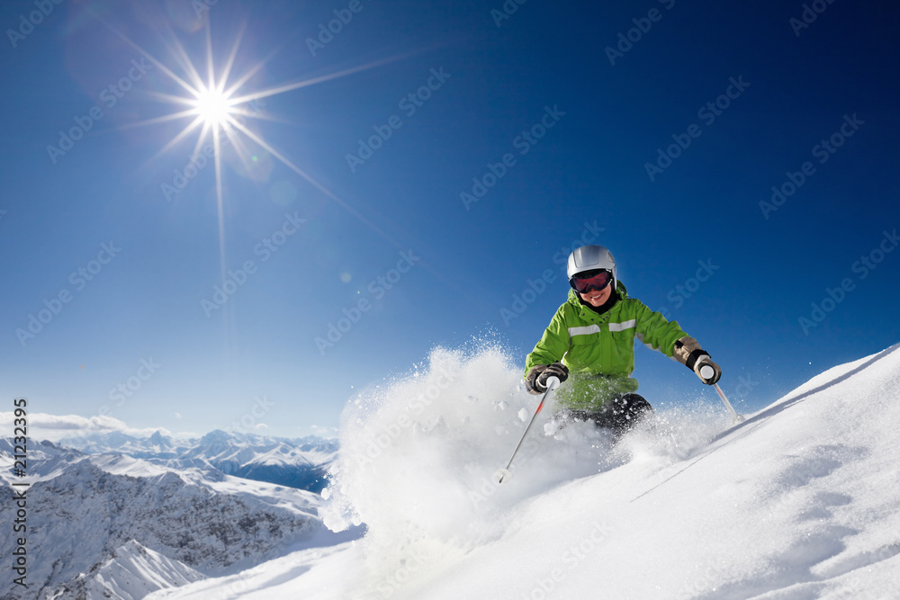 Happy female skier with mountain view