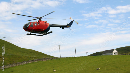 Helicopter flying over Scottish farmland