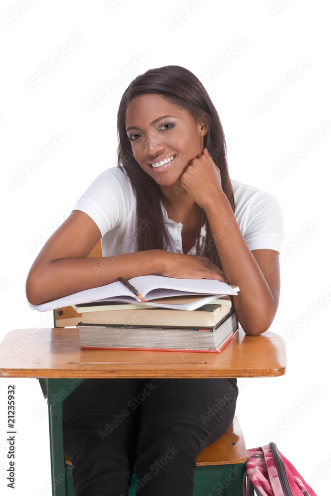 Black college student woman with book by desk Black college student woman with book by desk