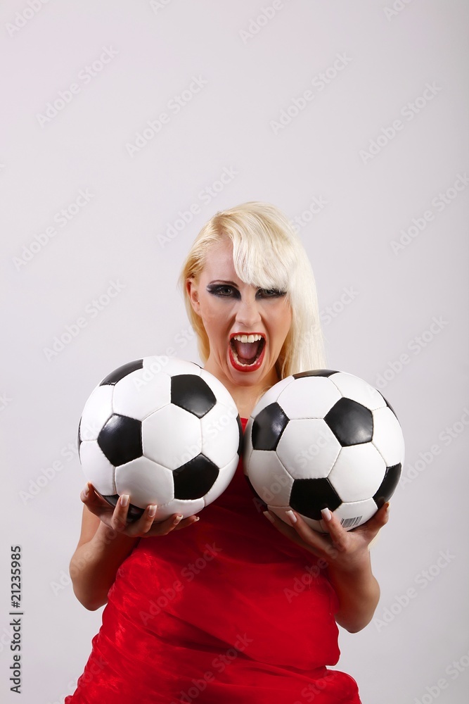 Fototapeta premium female crying football fan with two balls