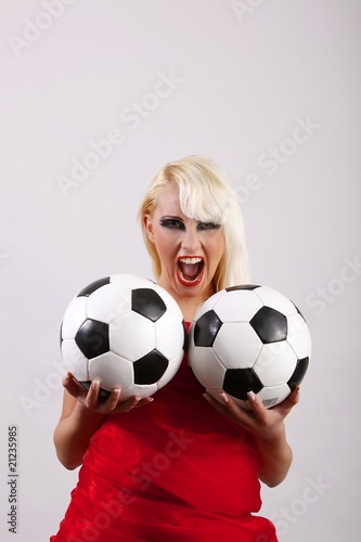 female crying football fan with two balls